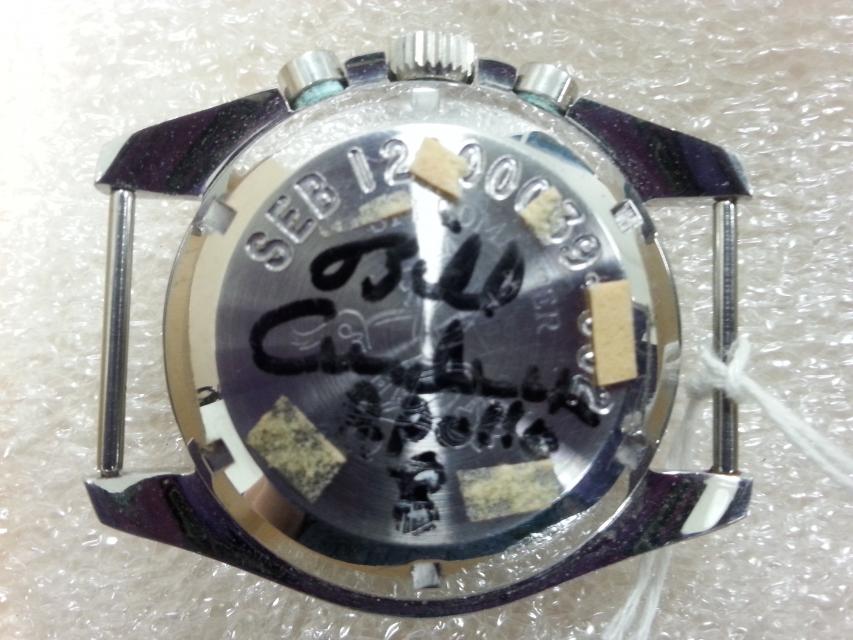 Reverse side of watch with signature in black marker