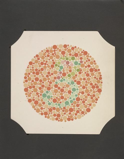 Circle filled with orange and red dots, green and blue dots in the make the shape of the number 3